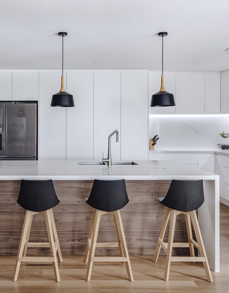 ustom-built kitchen with quality cabinetry, feature lighting and stone surfaces
