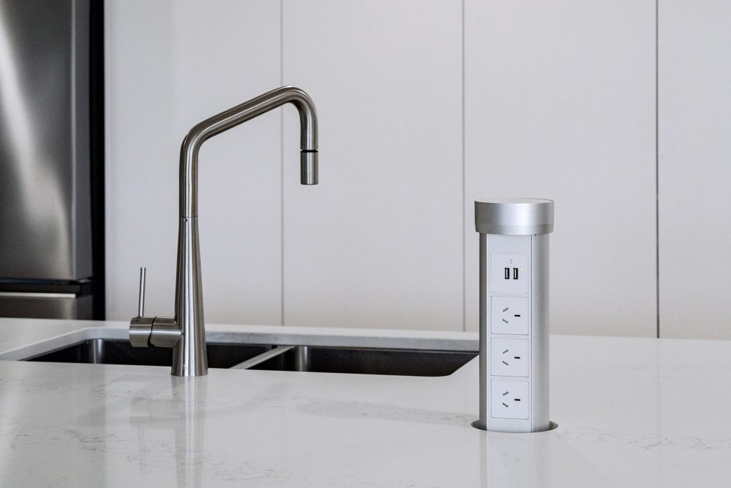 Smart electrical solutions in kitchen island. Functional and practical