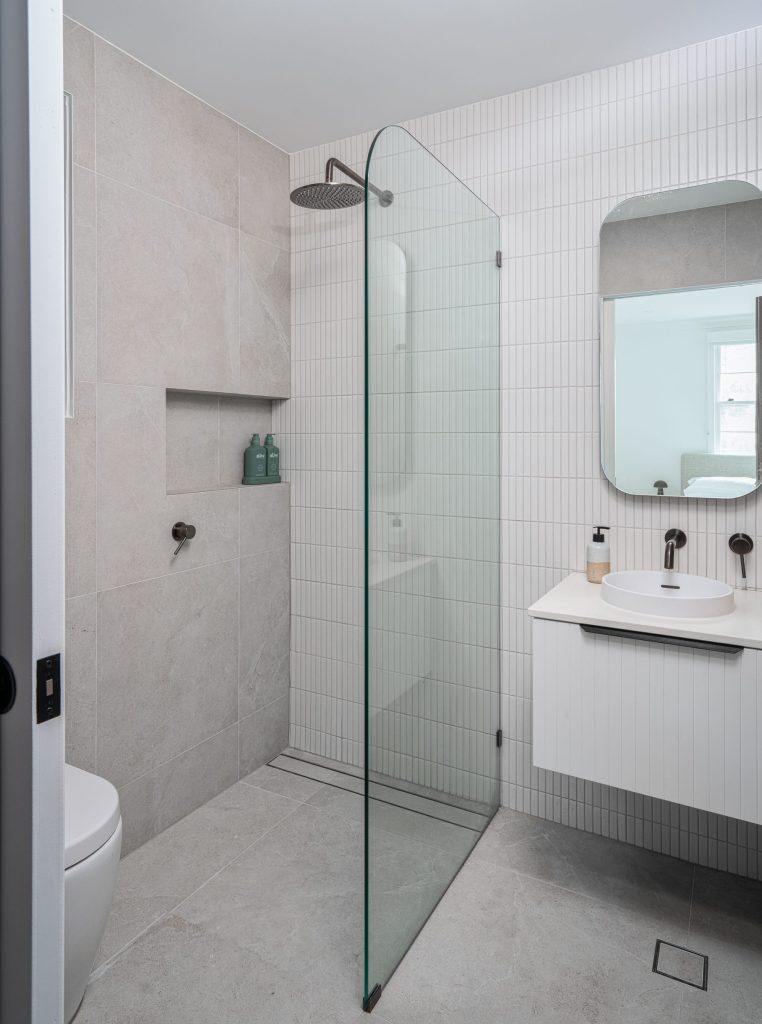 Minimalist bathroom with soft neutral finishes and modern fixtures