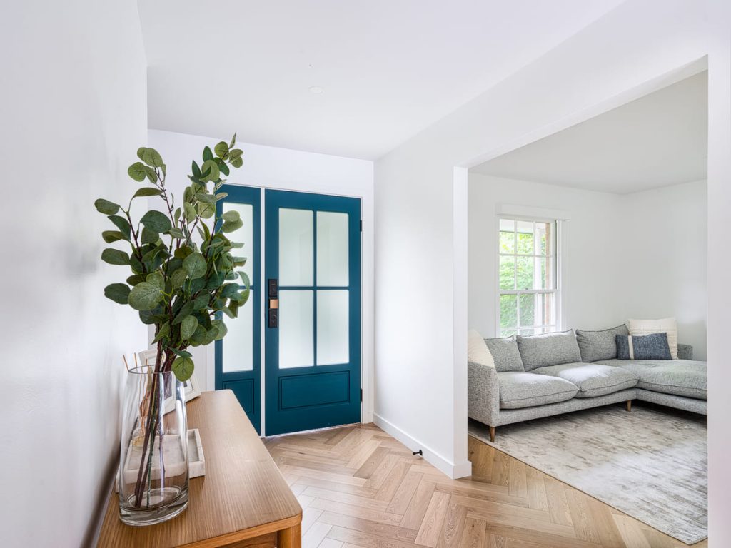 Timber flooring flowing through an open-plan living space