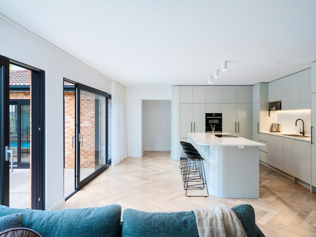 Custom-built kitchen with quality cabinetry, feature lighting and stone surfaces