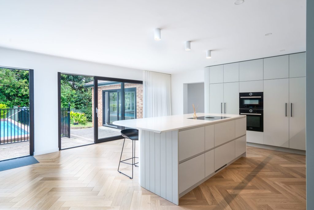 Custom-built kitchen with quality cabinetry, feature lighting and stone surfaces