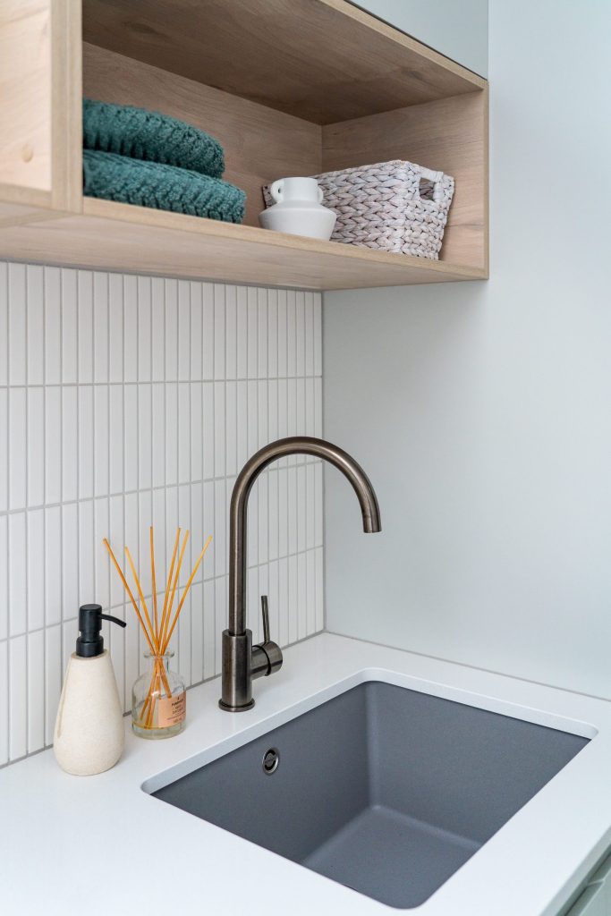 Quality gun metal finishes for this laundry tap and granite sink