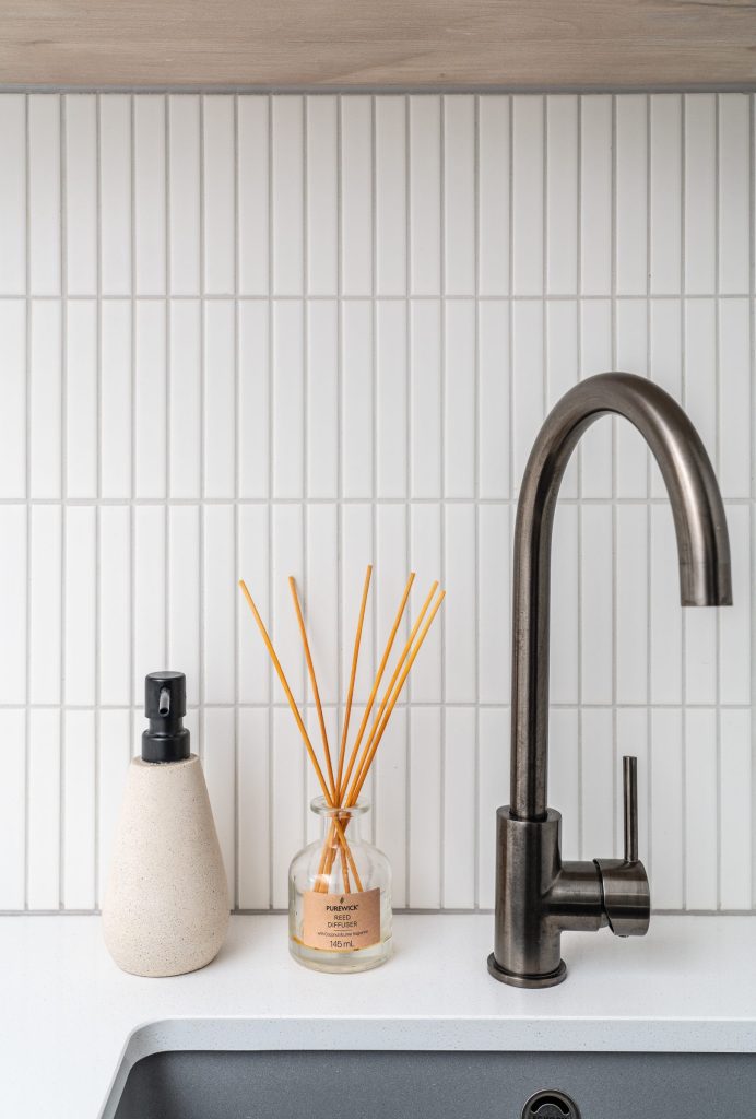 Quality gun metal finishes for this laundry tap and granite sink