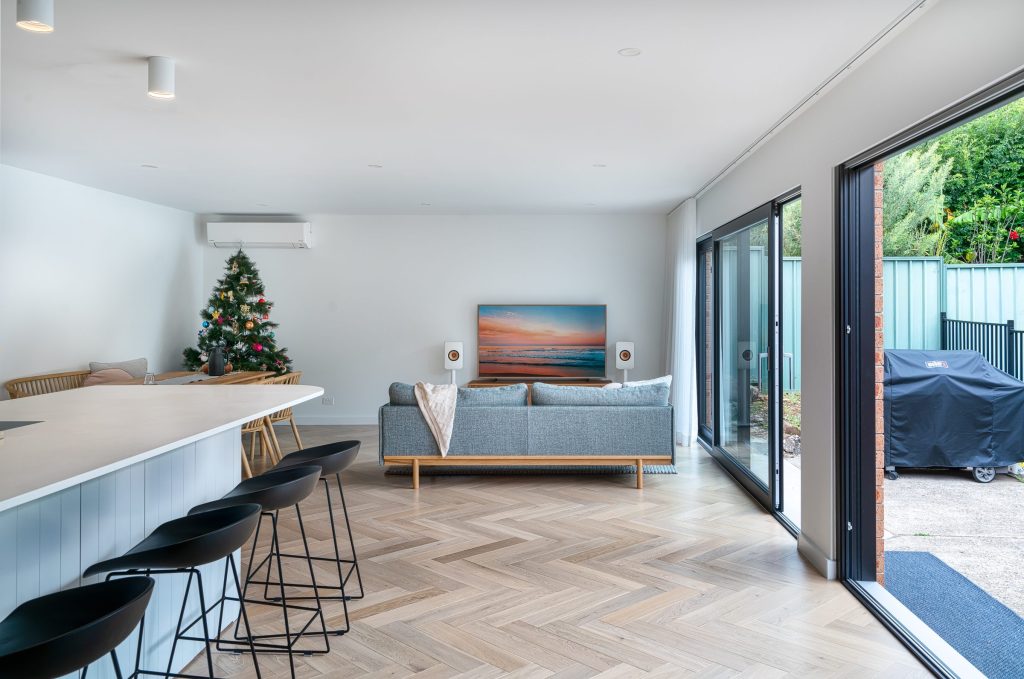 Modern family home featuring an open-plan kitchen, dining and living design