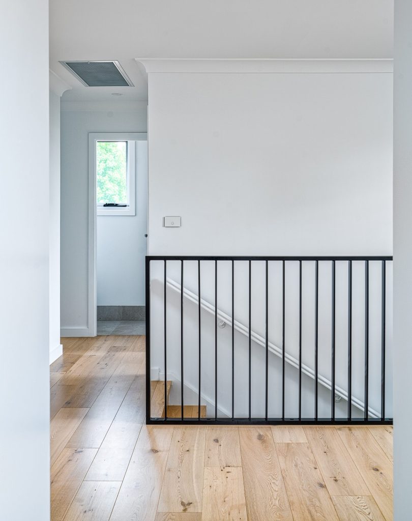 Custom simple yet modern matte black staircase balustrade