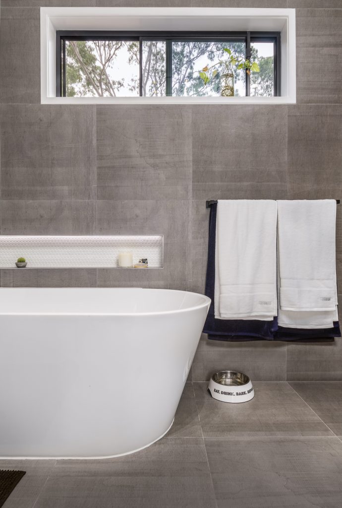 Master ensuite freestanding bath, full wall to ceiling tiles in parents retreat