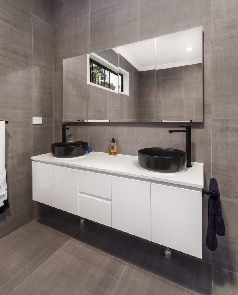 Wall mounted vanity with mirrored shaving cabinets