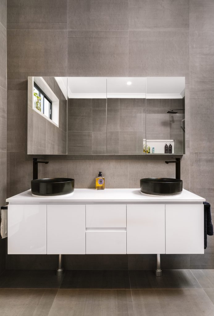 Wall mounted vanity with mirrored shaving cabinets