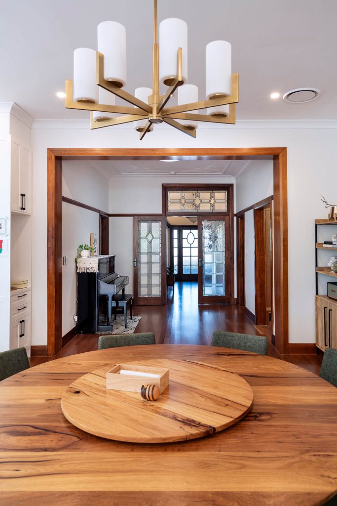 Timber flooring flowing through an open-plan living space