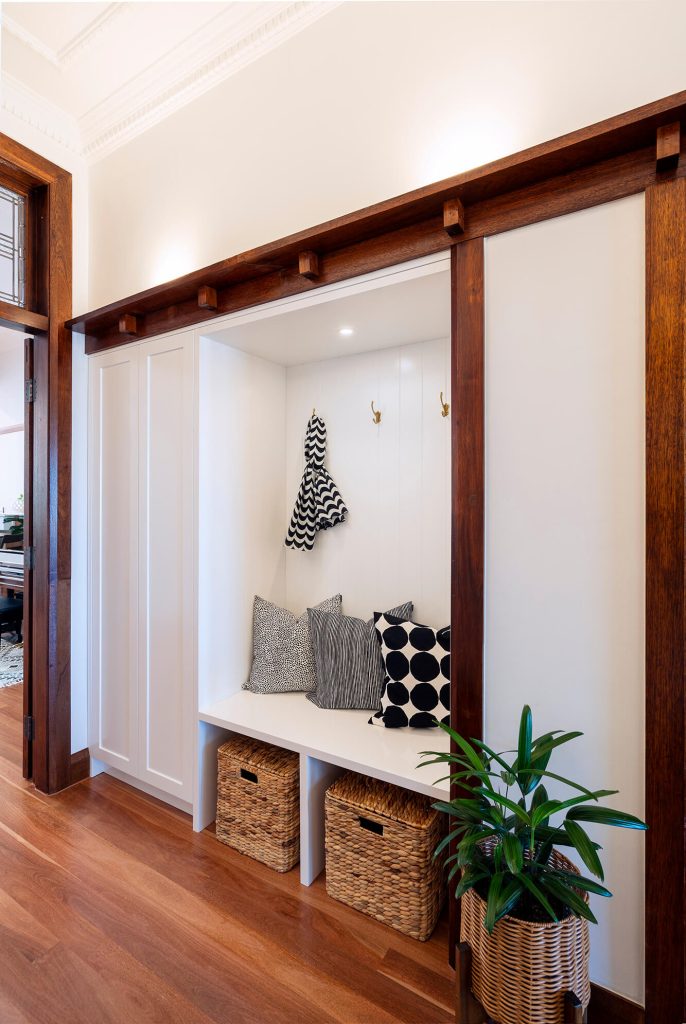 Custom built mudroom joinery concealed in the hallway