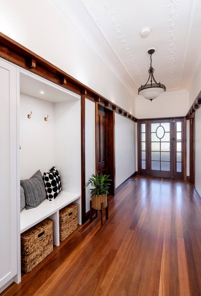 Timber flooring flowing through an open-plan living space