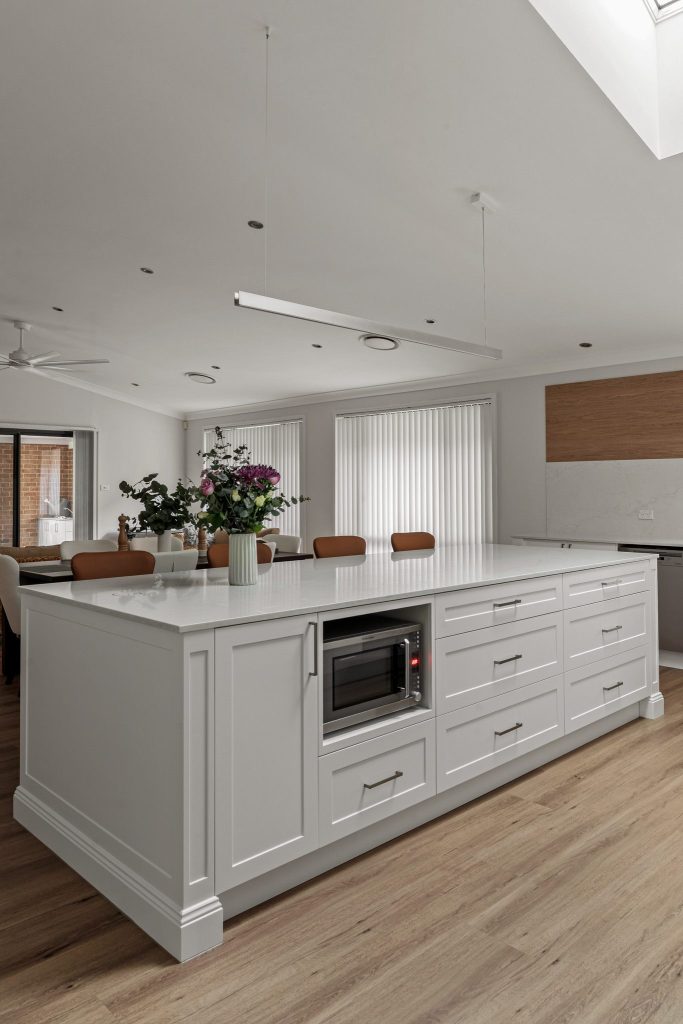Custom-built Shaker kitchen with quality cabinetry, feature lighting and stone surfaces