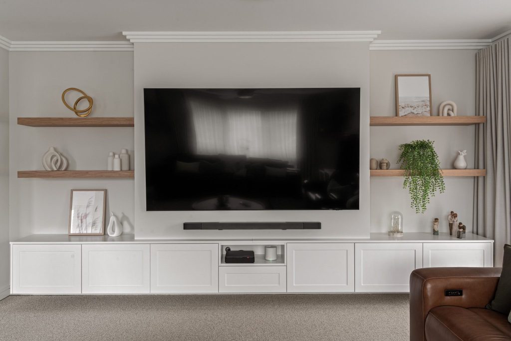 Built-in entertainment unit with bespoke timber joinery