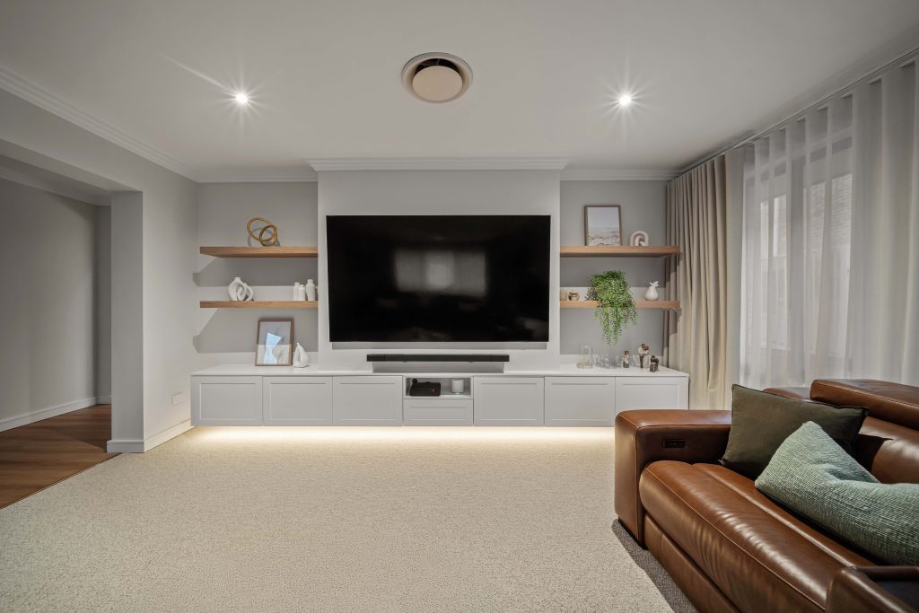 Built-in entertainment unit with bespoke timber joinery with led lighting