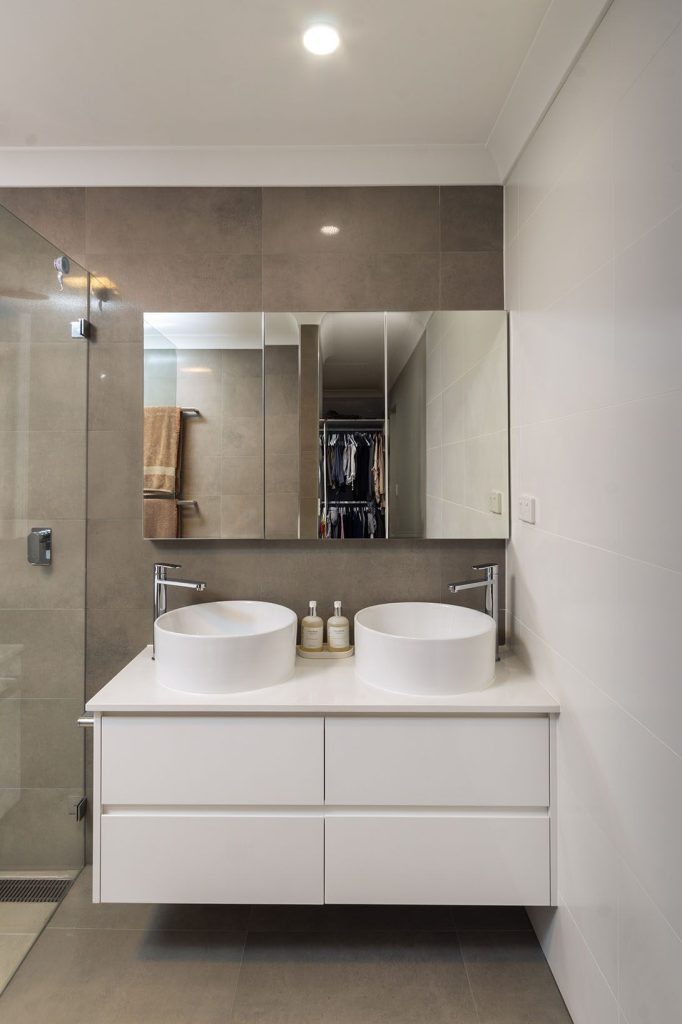 Luxury ensuite renovation with floor-to-ceiling tiling and quality fixtures