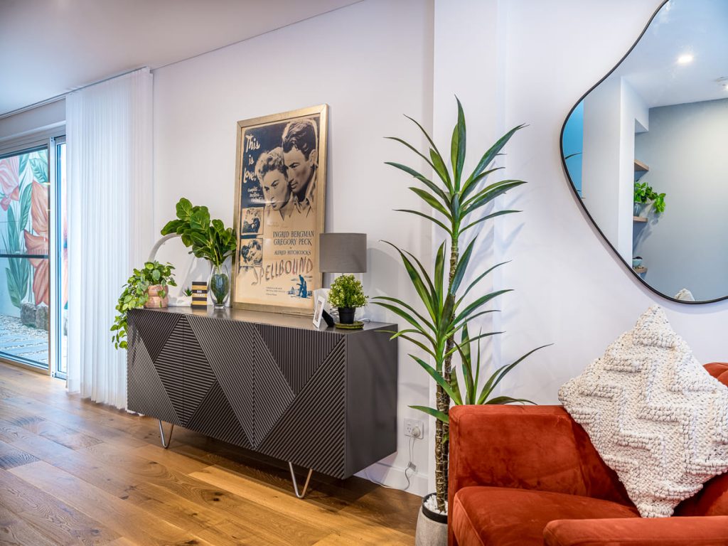 Timber flooring flowing through an open-plan living space