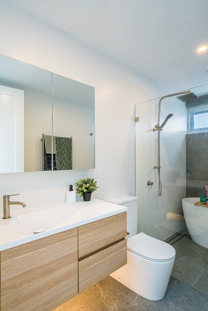 Modern bathroom with freestanding bathtub and custom timber vanity