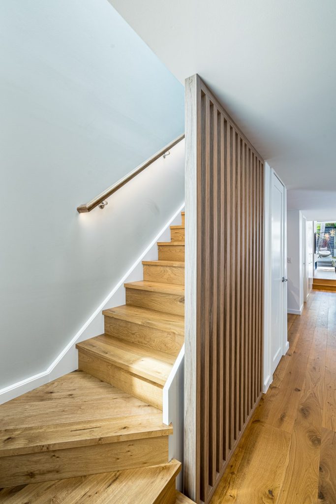 Custom slatted wall to staircase at Balmain Partial rebuild project